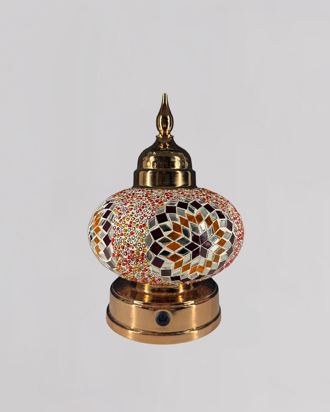 Decorative lamp with mosaic design on a white background