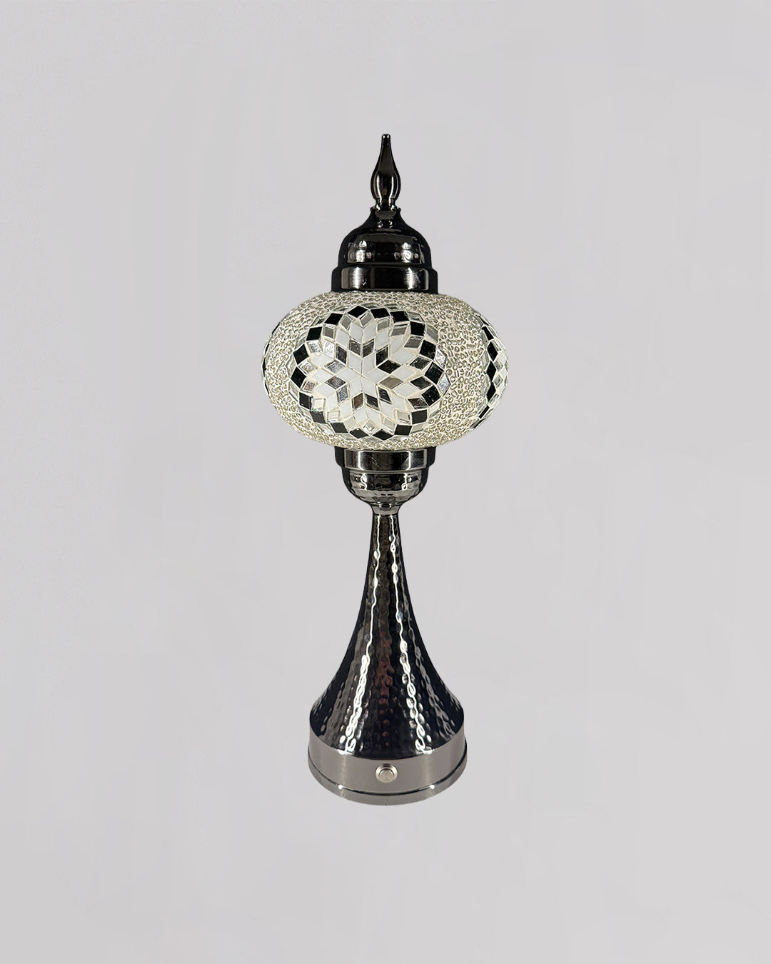 Decorative lamp with intricate design on a gray background