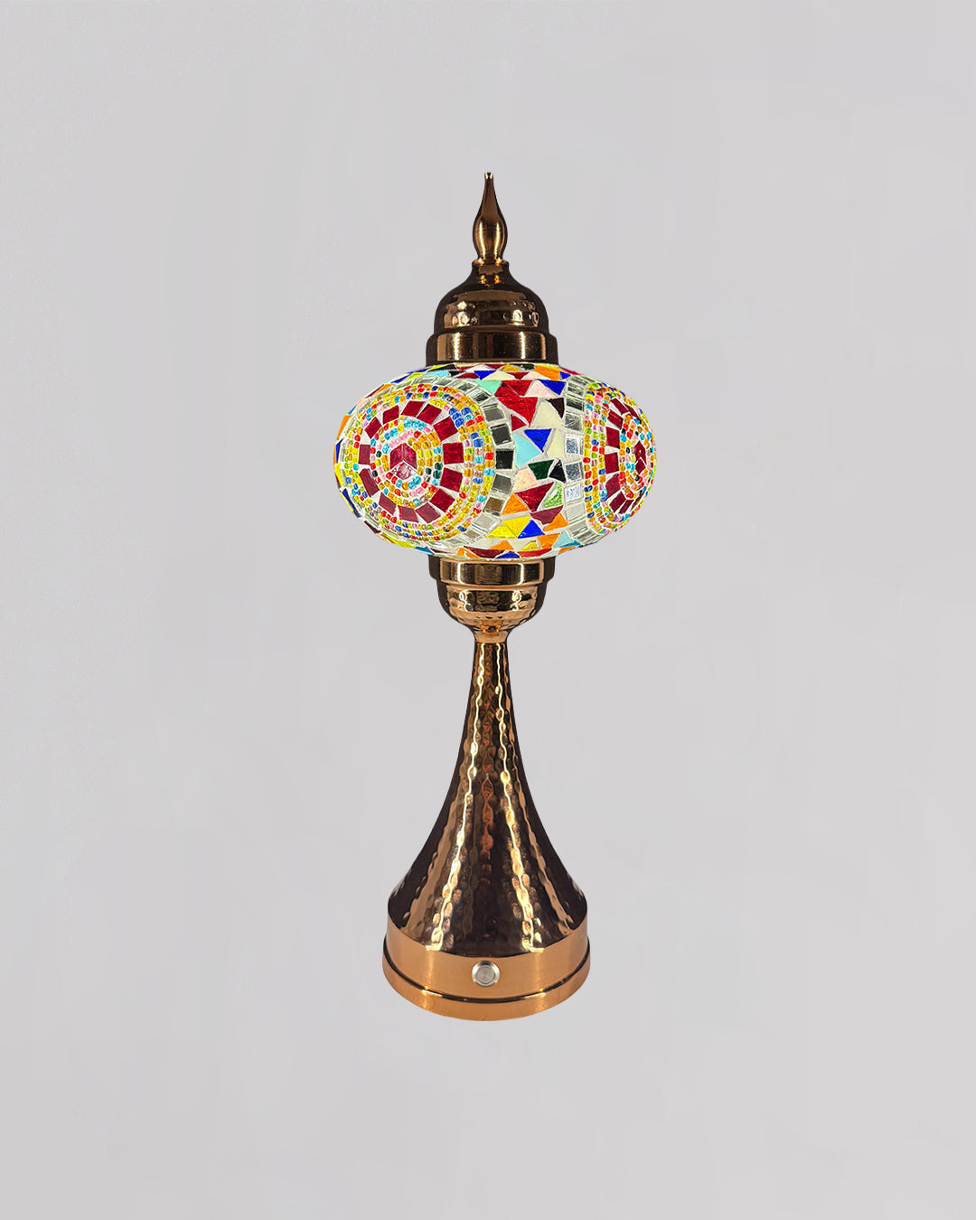 Decorative lamp with colorful mosaic design on a gray background