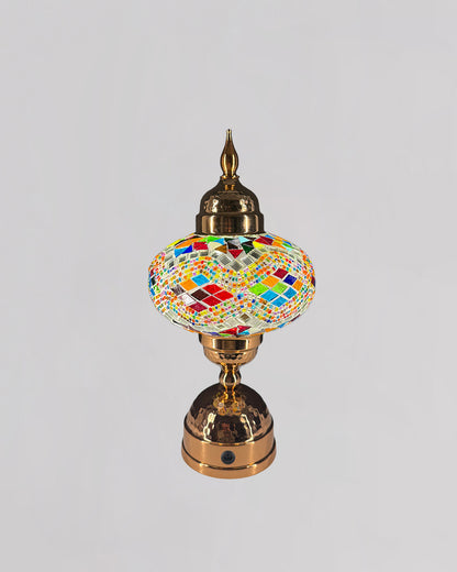 Decorative lamp with colorful mosaic design on a gray background