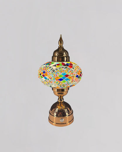 Decorative lamp with colorful mosaic design on a gray background