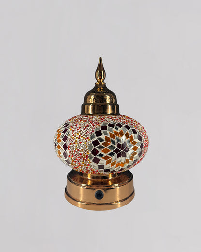 Decorative lamp with mosaic design on a white background