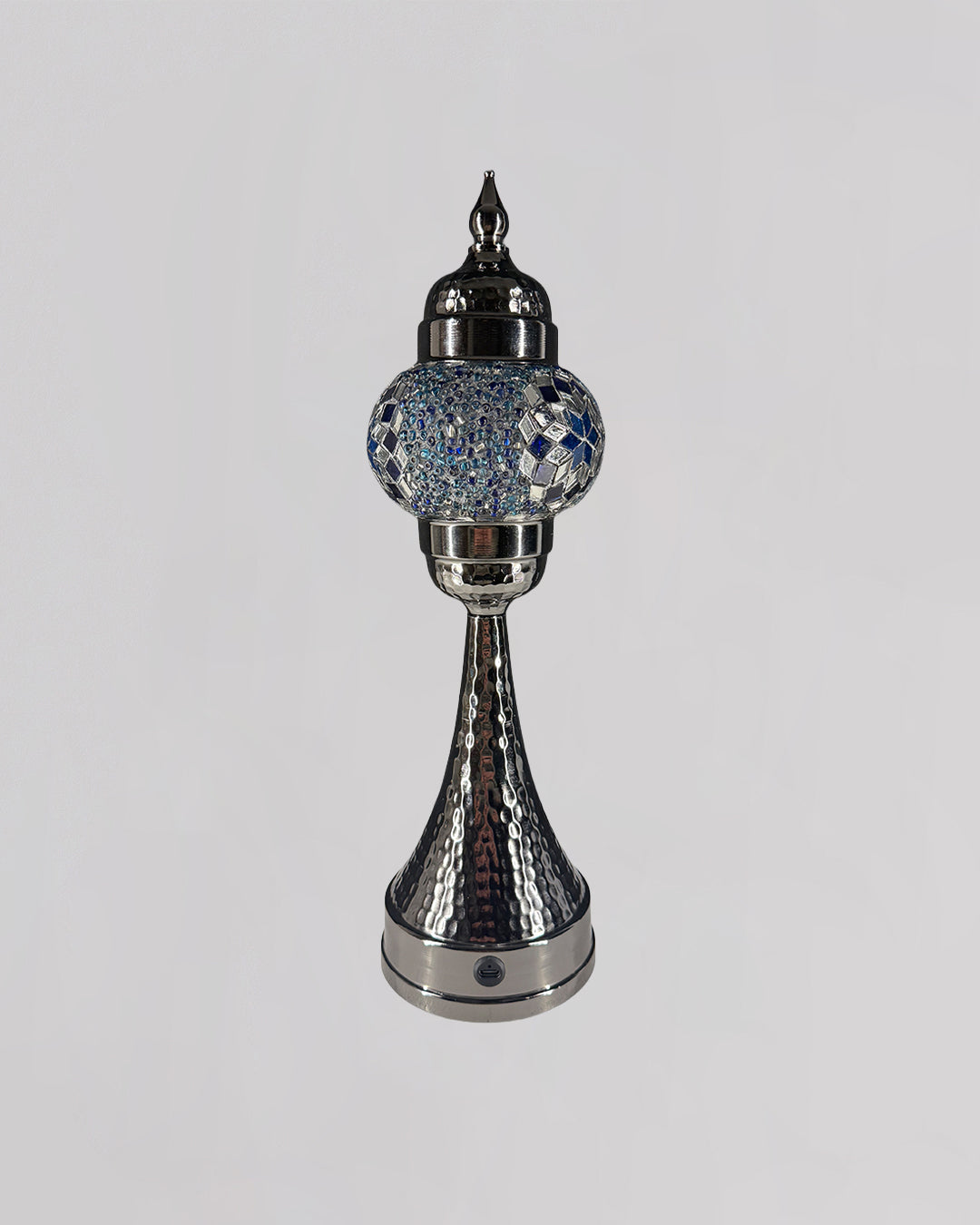 Decorative silver lamp with crystal embellishments on a white background