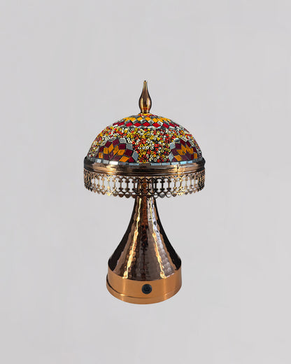 Decorative lamp with mosaic top on a gray background