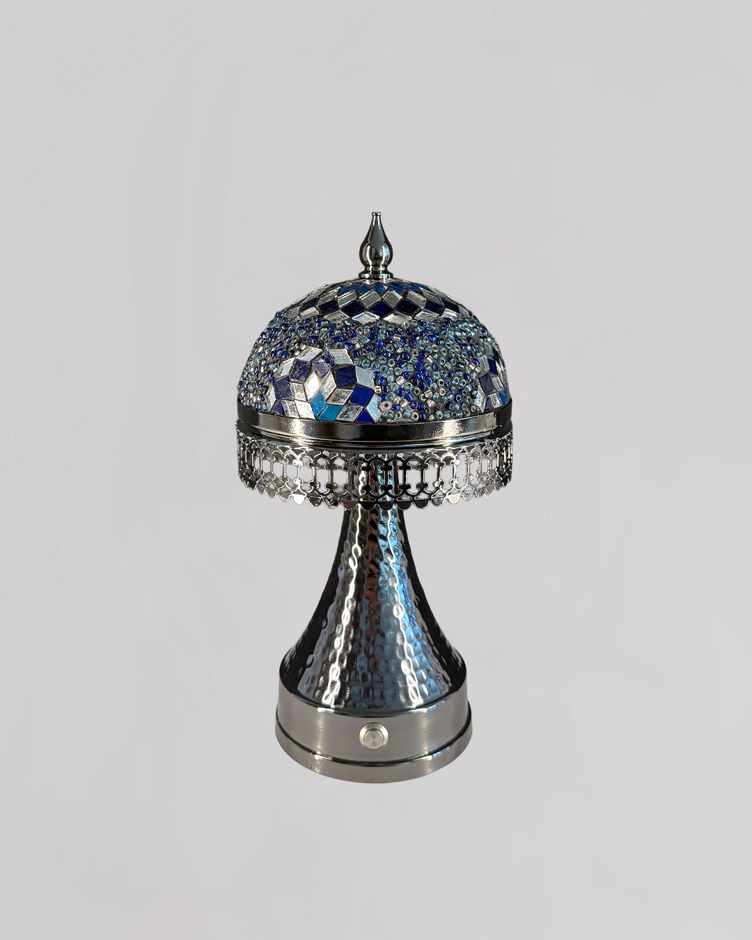 Decorative silver and blue object on a gray background